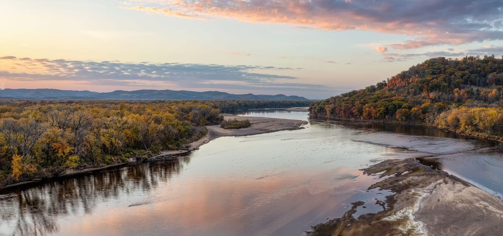 Aerial view of the Mississippi River winding through bluffs near La Crosse, Wisconsin at sunset
